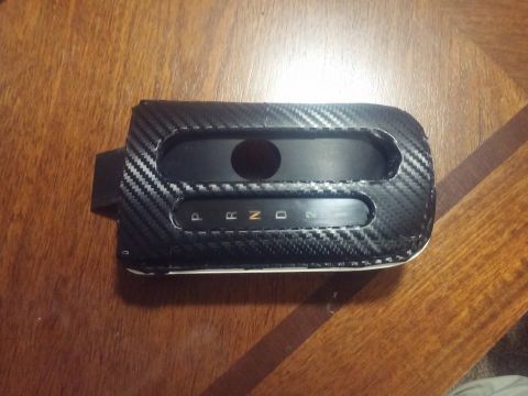 2000 Mercury Grand Marquis - This is a gear shifter surround with a carbon fiber wrap, displaying the gear selector positions.