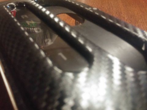 2000 Mercury Grand Marquis - Close-up of a vehicle's interior gear shifter console with carbon fiber trim.