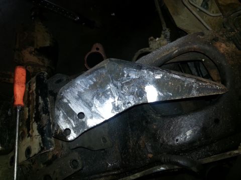 1994 Ford Bronco - Close-up view of a modified metal bracket attached to a vehicle's frame.