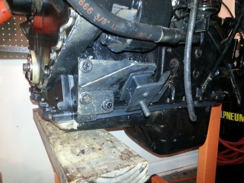 1994 Ford Bronco - Close-up of an engine block showing its mounting bracket and a rubber vibration dampener.