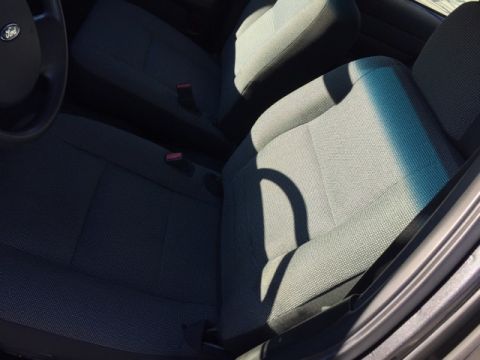 2001 Ford Crown Victoria - The interior of a Ford Crown Victoria, showing the front seats and part of the steering wheel.