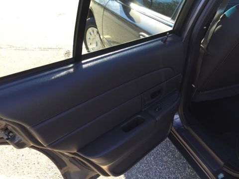 2001 Ford Crown Victoria - View of the interior door panel and window from the passenger side of a car.