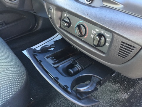 2001 Ford Crown Victoria - Interior view of a 2001 Ford Crown Victoria, showing the center console with climate controls and the gear shifter.