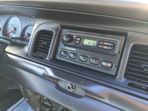2001 Ford Crown Victoria - Dashboard view of a 2001 Ford Crown Victoria, the radio and instrument cluster.