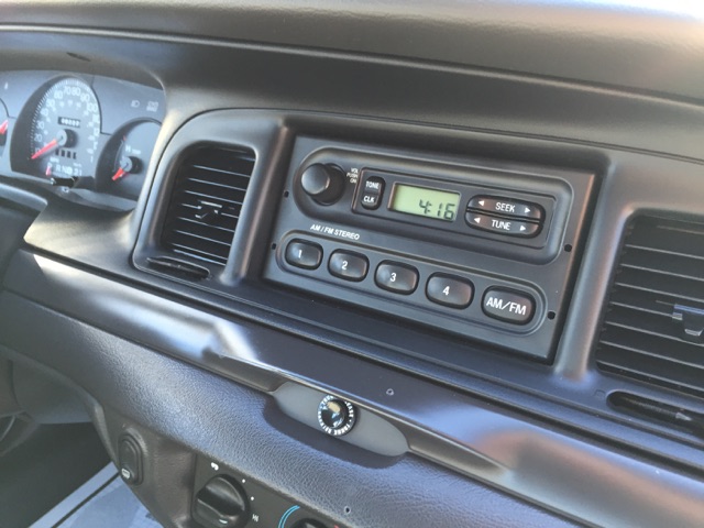 2001 Ford Crown Victoria interior showing dashboard, radio, and gauges