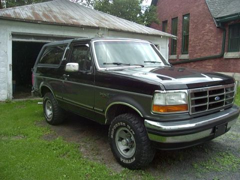 1992 Ford Bronco - Black 1992 Ford Bronco with chrome grille and bumper.