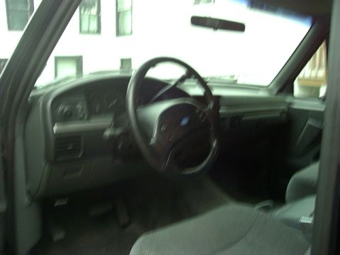 1992 Ford Bronco - Interior view of a 1992 Ford Bronco, showing the dashboard and steering wheel.