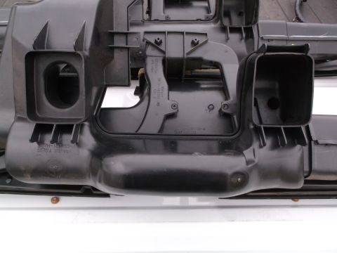 1999 Mercury Grand Marquis - This is a close-up, overhead view of a black plastic automotive HVAC ducting assembly, likely from the dashboard area. Visible text include…
