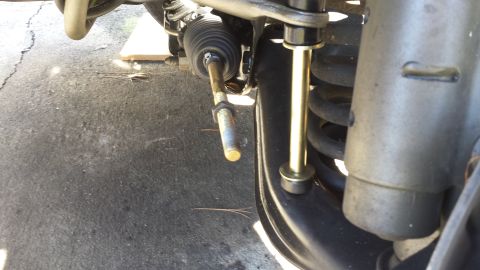 1980 Ford Mustang - Front suspension detail showing a sway bar link and steering rack components.