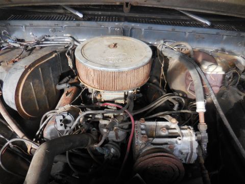 1979 Ford Bronco - Close-up view of the engine compartment, showing various mechanical components and wiring.