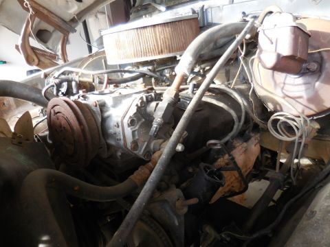 1979 Ford Bronco - Close-up view of a V8 engine bay, showing various components and wiring.