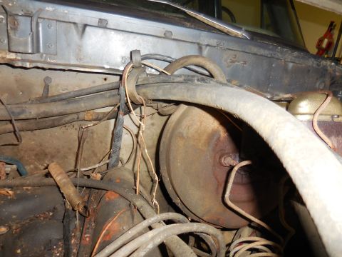 1979 Ford Bronco - Close-up view of engine bay components including brake booster and various hoses.