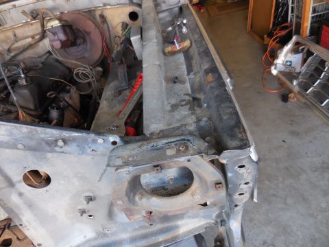 1979 Ford Bronco - This is a close-up, high-angle shot of the engine bay of a classic vehicle undergoing restoration. Visible components include the brake boo…