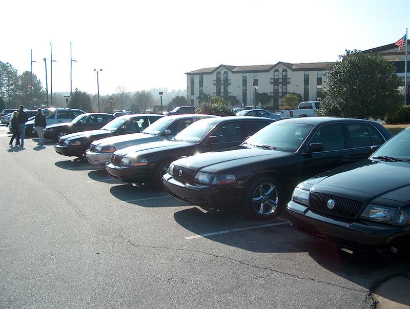 2001 Ford Crown Victoria sedans parked in a lot, front view