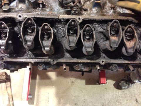 1979 Ford Bronco - This is a close-up, overhead view of the internal components of a V8 engine, likely a Ford small-block, showing the rocker arms and valve s…