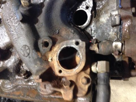 1979 Ford Bronco - This image shows a close-up view of a metallic engine component, likely part of an exhaust system.