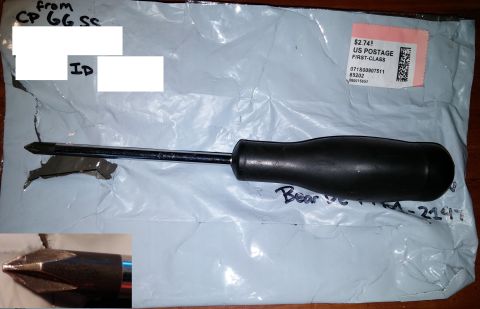2000 Ford Crown Victoria - A Phillips head screwdriver is laid across a white padded envelope. The envelope has handwritten text and a postage stamp. A close-up inset…