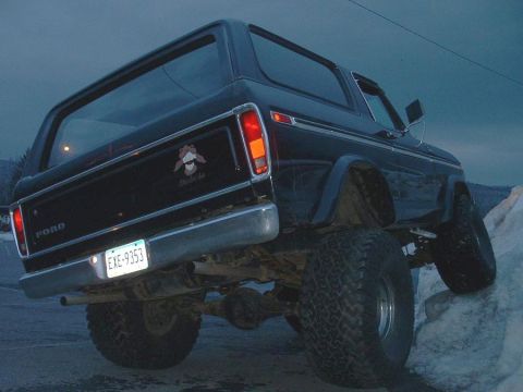 1978 Ford Bronco - This 1978 Ford Bronco is shown from a low rear angle, with its rear tire on a rock.