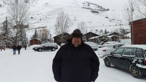 1994 Ford Bronco - Photograph of a person in a snowy lot, not a technical document.