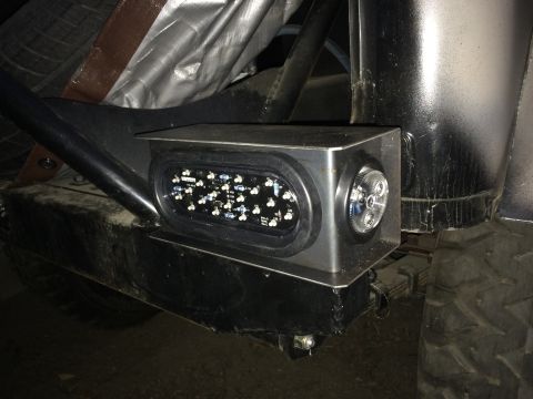1987 Suzuki Samurai - Photograph of an LED light enclosure mounted to a fabricated bumper, not a technical document.