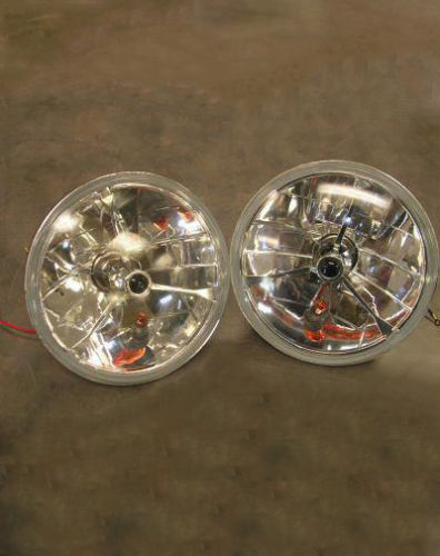 1987 Suzuki Samurai - Photograph of a pair of round headlight assemblies, not a technical document.