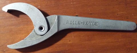 2000 Ford Crown Victoria - A close-up of a specialized adjustable wrench marked with the Rolls-Royce brand name.