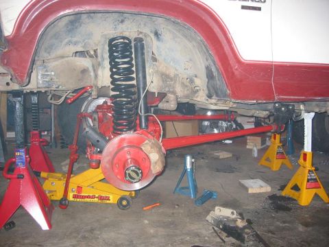 1985 Ford Bronco - Suspension work on a 1985 Ford Bronco, showing the rear axle and modified control arms.