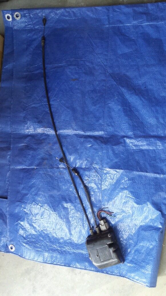 Door lock actuator with cables on blue tarp