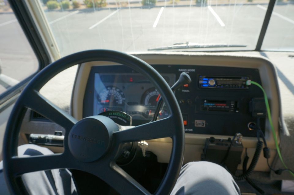 1995 Chevrolet P30 1 Ton - Step Van interior showing steering wheel, dashboard with radio, and gauges