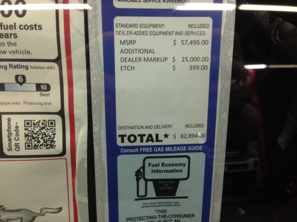 Dealer window sticker listing MSRP $57,495.00, $25,000.00 dealer markup and $82,894.00 total