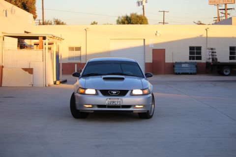 2002 Ford Mustang - Front view of a silver 2002 Ford Mustang with a license plate reading 4VOM193.