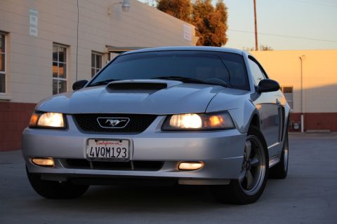 2002 Ford Mustang - Front view of a silver 2002 Ford Mustang parked outdoors.