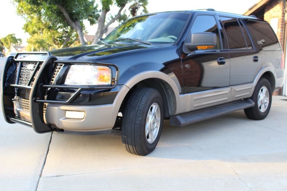 2003 Ford Expedition SUV with brush guard and running boards