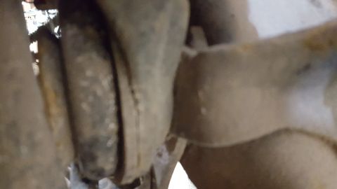 1995 Ford Bronco - Rusty vehicle suspension components are visible in this close-up shot.