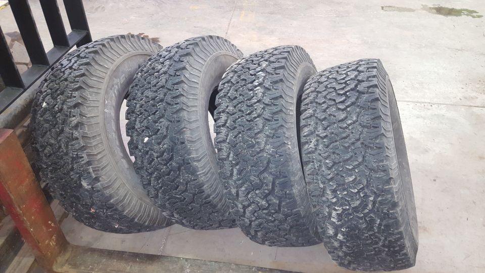 four off-road tires lined up
