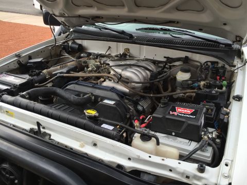 2001 Toyota Tacoma - The engine bay of a truck, a WARN VR10000 winch and a Supermotors.net watermark.