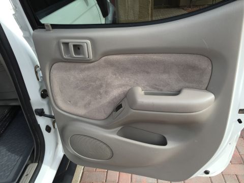 2001 Toyota Tacoma - Close-up view of the interior door panel of a vehicle.