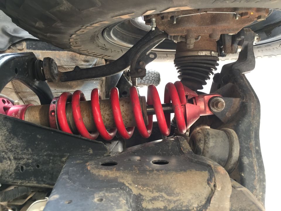 Front suspension part with red coilover shock absorber