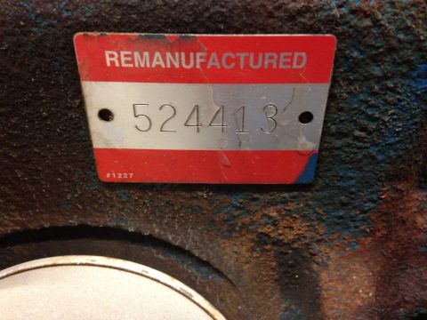 1979 Ford Bronco - Close-up of a remanufactured engine part, showing the serial number 524413 and the word 'REMANUFACTURED'.