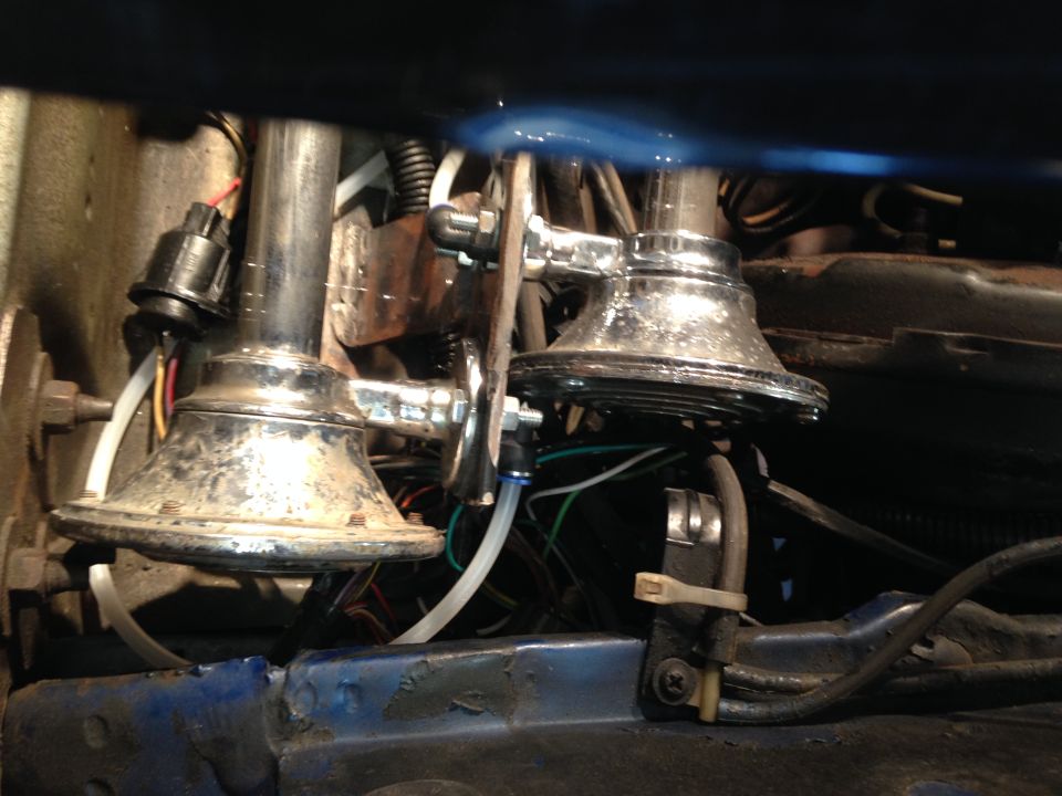 Chrome air horns with visible wiring and tubing