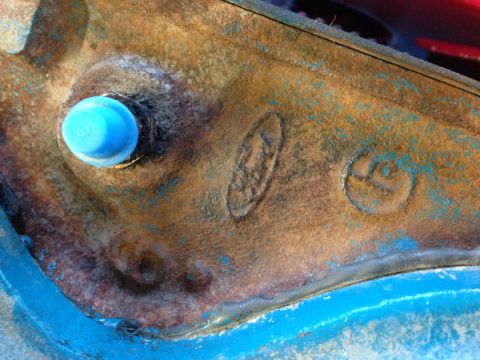 1979 Ford Bronco - Engine part showing an embossed Ford logo, possibly from a 1979 vehicle.