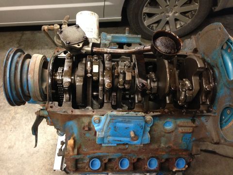 1979 Ford Bronco - Close-up of a disassembled engine block, showing internal components and signs of wear.
