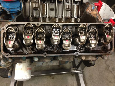 1979 Ford Bronco - Close-up of an engine's valve train, showing rocker arms and an oil filter. Supermotors.net logo is present.