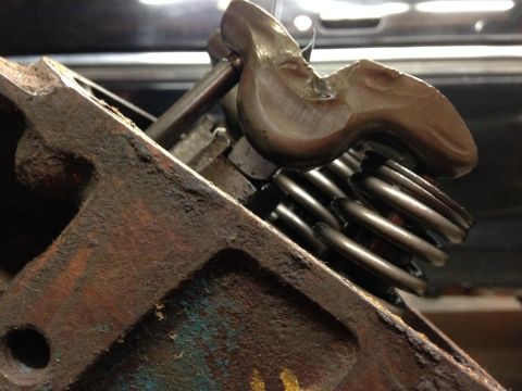 1979 Ford Bronco - Engine valve train components, including valve springs and a rocker arm, are visible on a rusty engine block.