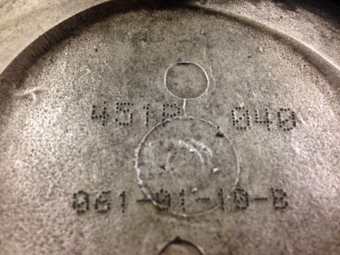 1979 Ford Bronco - Close-up of an engine component showing casting numbers and manufacturing codes.