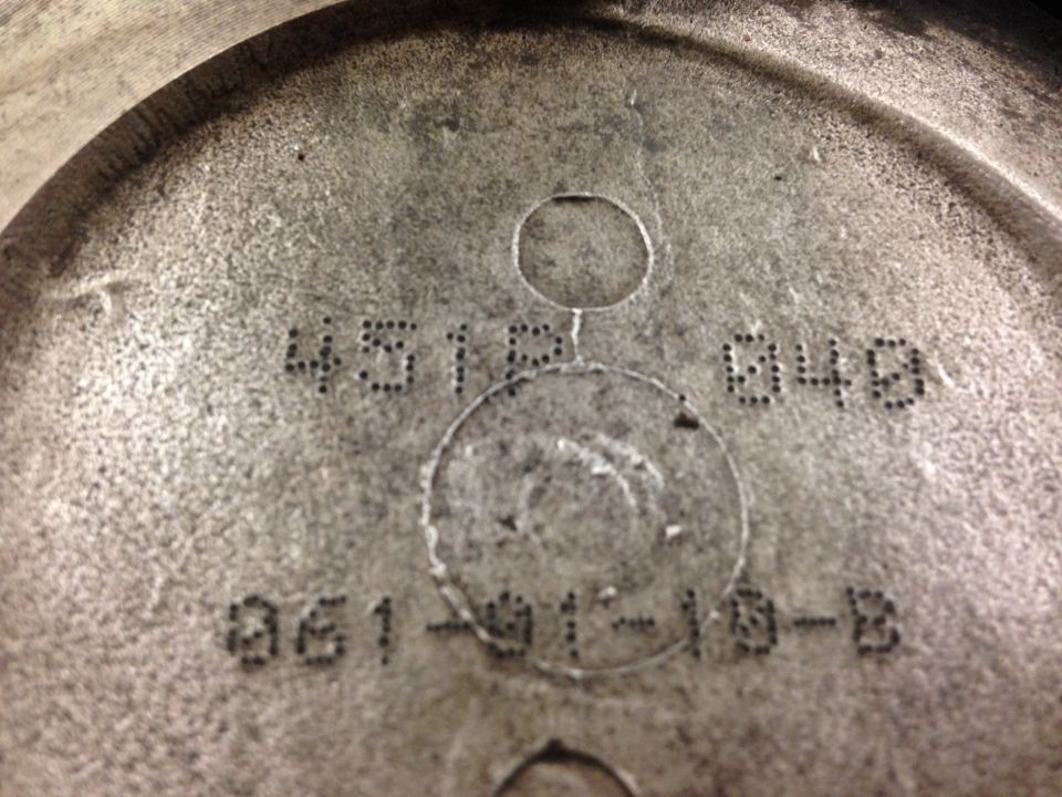 Metal engine part with stamped numbers 4512 048 and 861-01-10-B