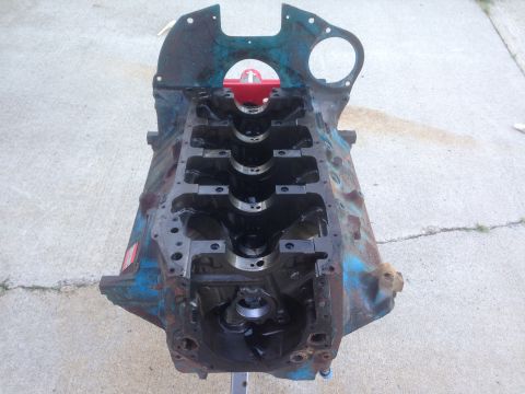 1979 Ford Bronco - This engine block, possibly from a Ford vehicle, is shown on a stand, ready for rebuild or inspection.