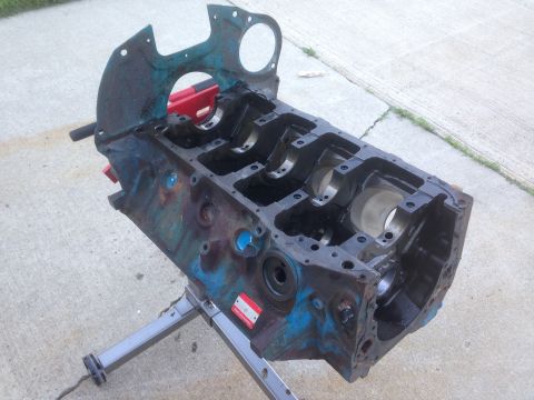 1979 Ford Bronco - Engine block on a stand, ready for rebuild. No specific year or vehicle identified.