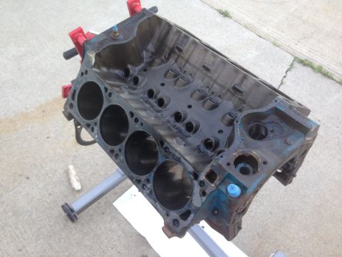 1979 Ford Bronco - This is a close-up view of a bare engine block, likely undergoing or awaiting rebuild, resting on an engine stand.