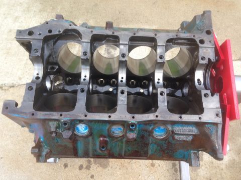 1979 Ford Bronco - An engine block, likely from a V8, is shown with its crankshaft bearings and cylinder bores exposed.